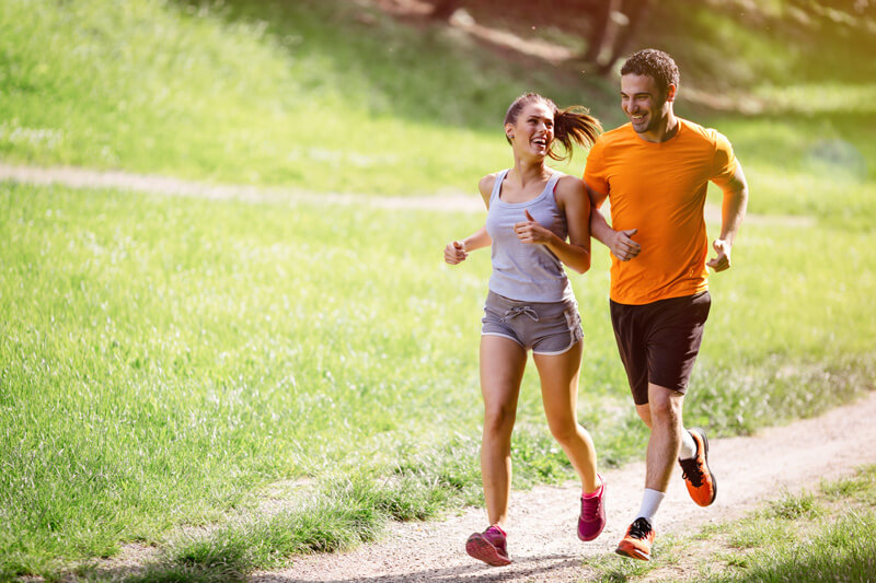 couple happy jogging